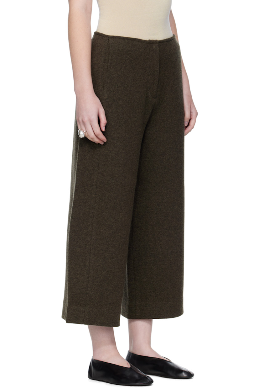 Knit wool-blend trousers.

· Two-pocket styling
· Zip fly
· Mock pockets at back
· Central crease at back legs

Supplier color: Dark olive