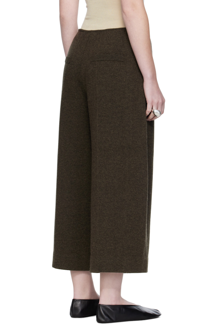 Knit wool-blend trousers.

· Two-pocket styling
· Zip fly
· Mock pockets at back
· Central crease at back legs

Supplier color: Dark olive