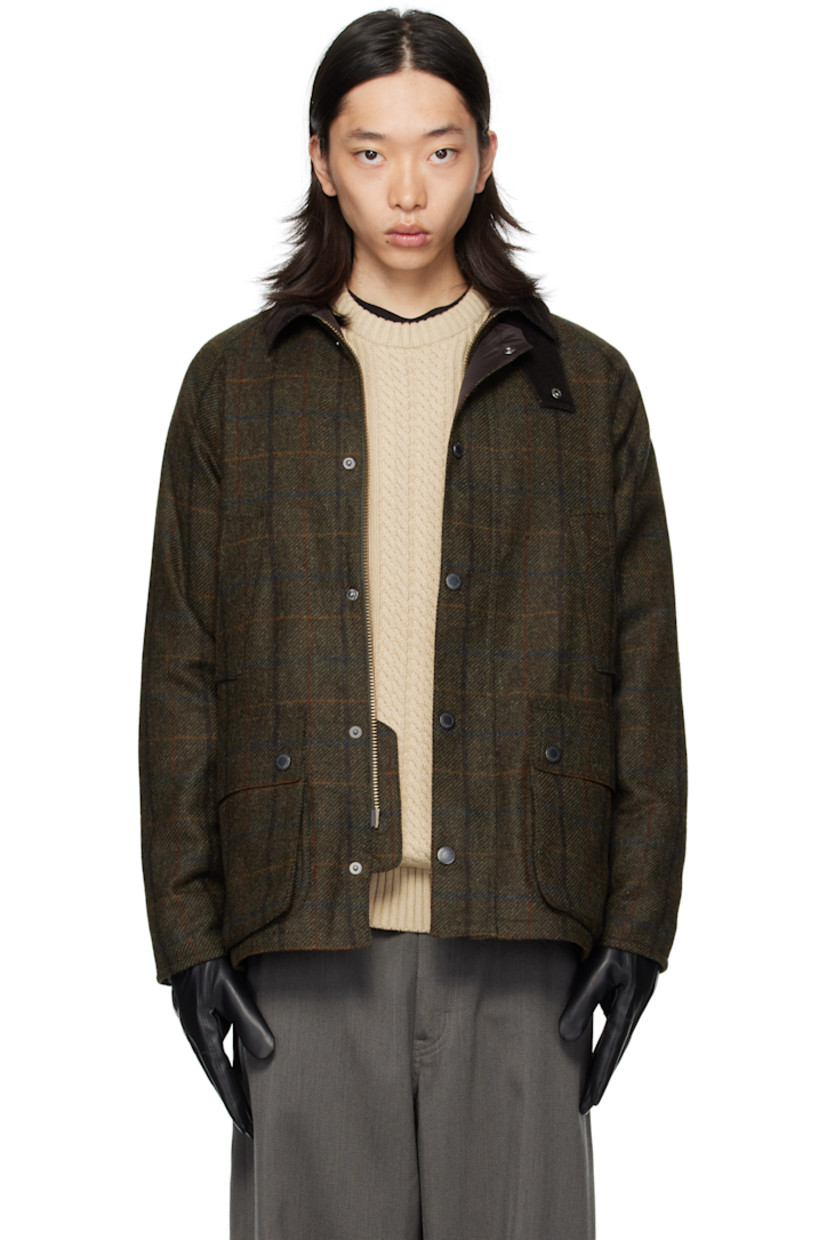 Insulated wool melton jacket.

· Check pattern throughout
· Rivets at corduroy spread collar
· Press-stud throat guard
· Zip closure with press-stud placket
· Welt pockets and flap pockets at front
· Logo embroidered at front
· Raglan sleeves
· Metal eyelets at underarms
· Press-stud expansion panels at back hem
· Patch pocket at interior
· Full quilted satin lining

Supplier color: Brown