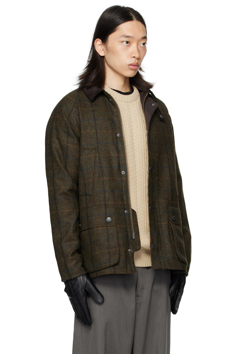 Insulated wool melton jacket.

· Check pattern throughout
· Rivets at corduroy spread collar
· Press-stud throat guard
· Zip closure with press-stud placket
· Welt pockets and flap pockets at front
· Logo embroidered at front
· Raglan sleeves
· Metal eyelets at underarms
· Press-stud expansion panels at back hem
· Patch pocket at interior
· Full quilted satin lining

Supplier color: Brown