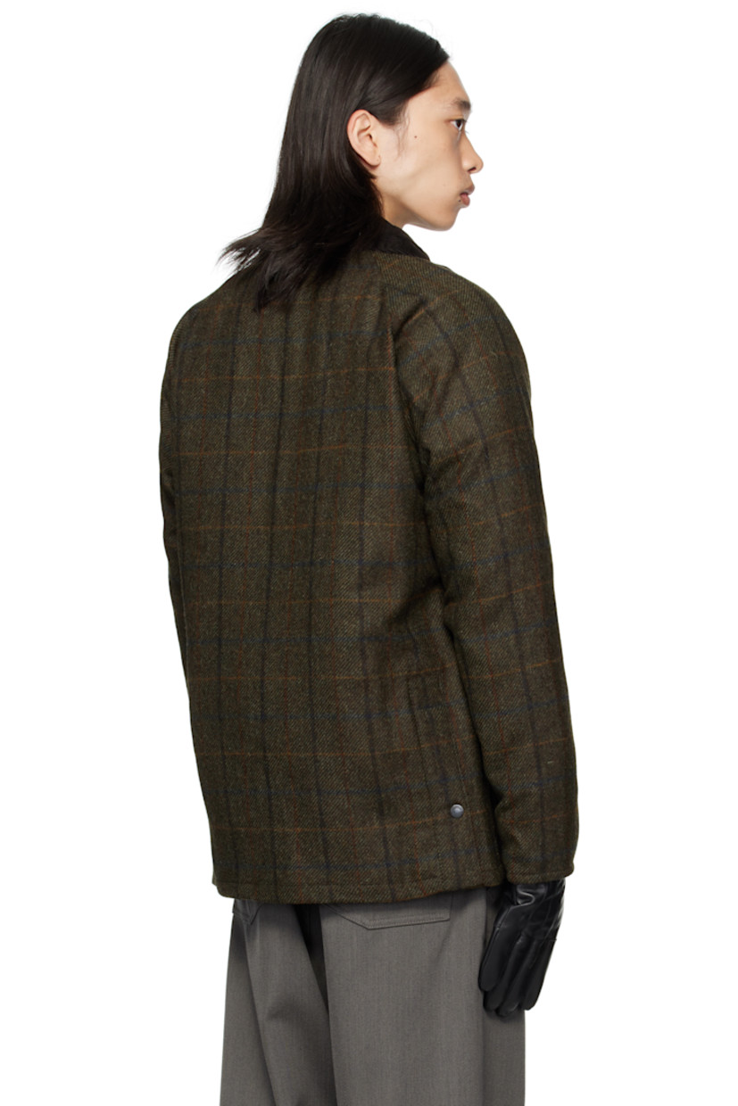 Insulated wool melton jacket.

· Check pattern throughout
· Rivets at corduroy spread collar
· Press-stud throat guard
· Zip closure with press-stud placket
· Welt pockets and flap pockets at front
· Logo embroidered at front
· Raglan sleeves
· Metal eyelets at underarms
· Press-stud expansion panels at back hem
· Patch pocket at interior
· Full quilted satin lining

Supplier color: Brown