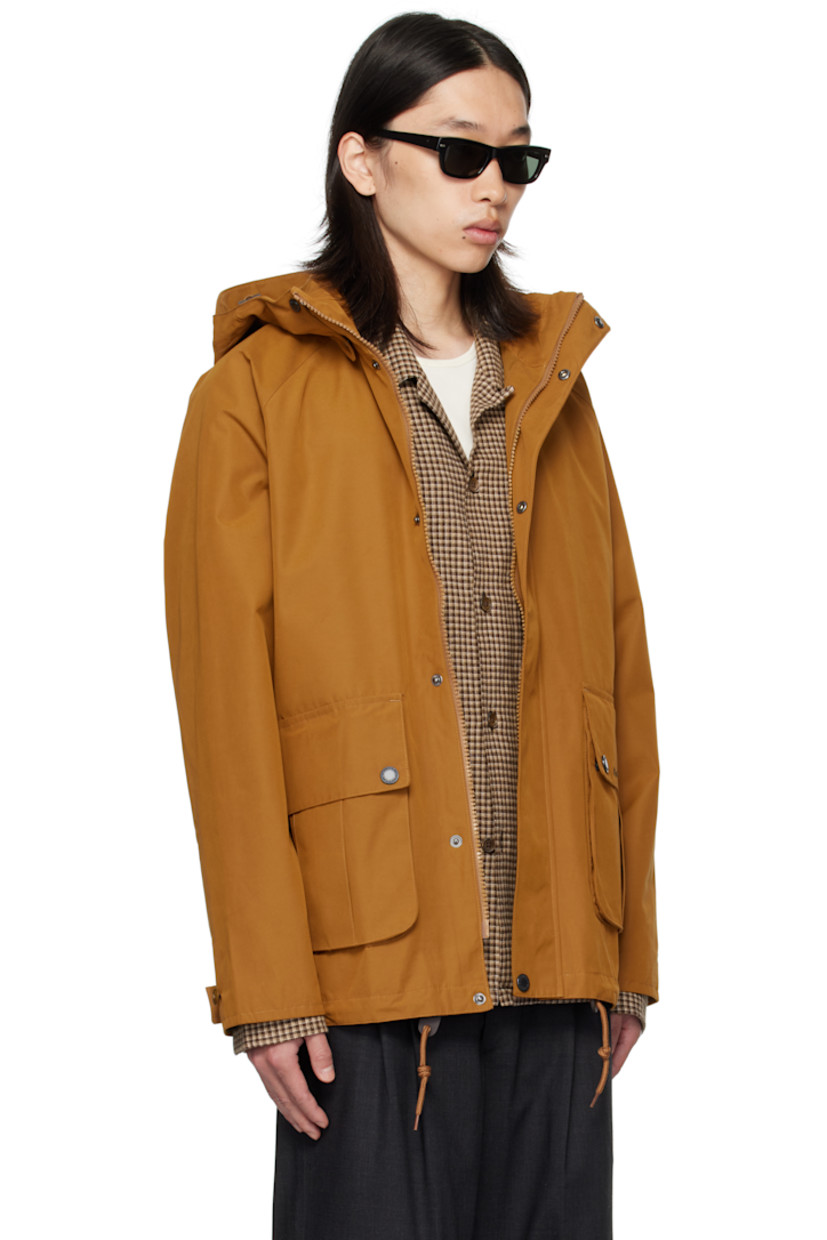 Coated canvas jacket.

· Waterproof
· Bungee-style drawstring at detachable hood
· Stand collar
· Two-way zip closure with press-stud placket
· Flap pockets and embroidered logo at front
· Cord-lock drawstring at hem
· Raglan sleeves
· Metal eyelets at underarms
· Adjustable button tab at cuffs
· Locker loop at back collar
· Patch pocket at interior
· Full satin and flannel lining

Supplier color: Bronze brown