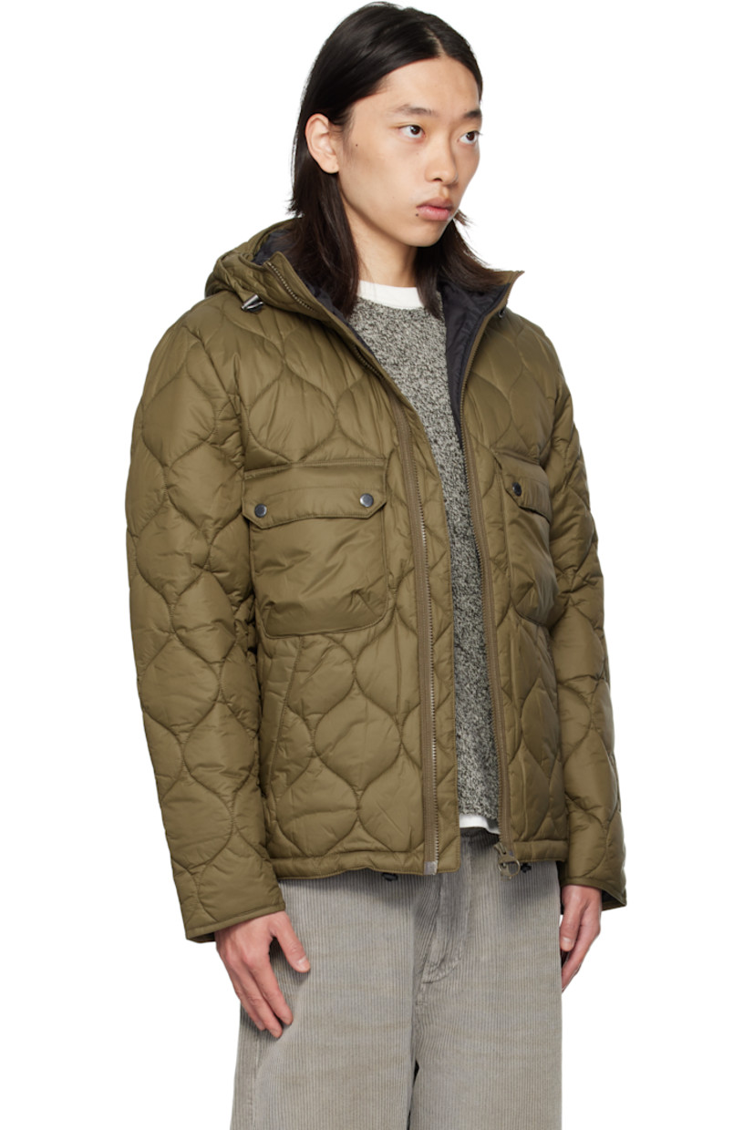 Insulated and quilted nylon ripstop jacket.

· Bungee-style drawstring at hood
· Stand collar
· Two-way zip closure
· Flap pockets and embroidered logo at front
· Bungee-style drawstring at hem
· Locker loop at back collar
· Patch pocket at interior
· Full satin lining

Supplier color: Beech