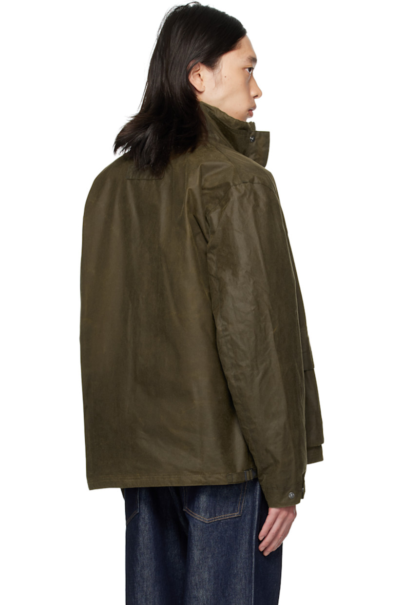 Waxed cotton canvas jacket. 

· Stand collar 
· Concealed two-way zip closure
· Press-stud placket 
· Flap pockets, D-ring, and logo embroidered at front
· Grommets at side seams
· Press-stud cuffs
· Cinch tabs at back hem 
· Patch pocket at interior 
· Partial twill lining

Supplier color: Beech