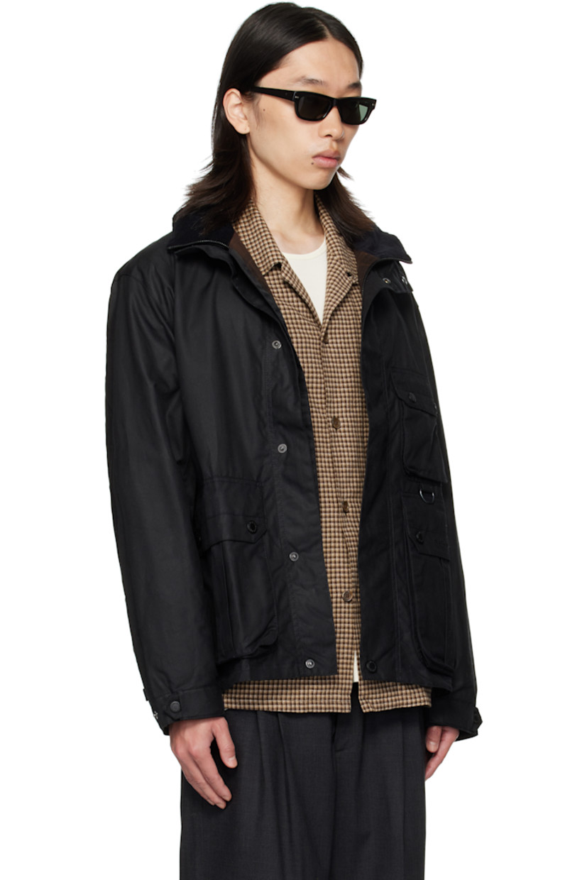 Waxed cotton canvas jacket. 

· Stand collar 
· Concealed two-way zip closure
· Press-stud placket 
· Flap pockets, D-ring, and logo embroidered at front
· Grommets at side seams
· Press-stud cuffs
· Cinch tabs at back hem 
· Patch pocket at interior 
· Partial twill lining

Supplier color: Black