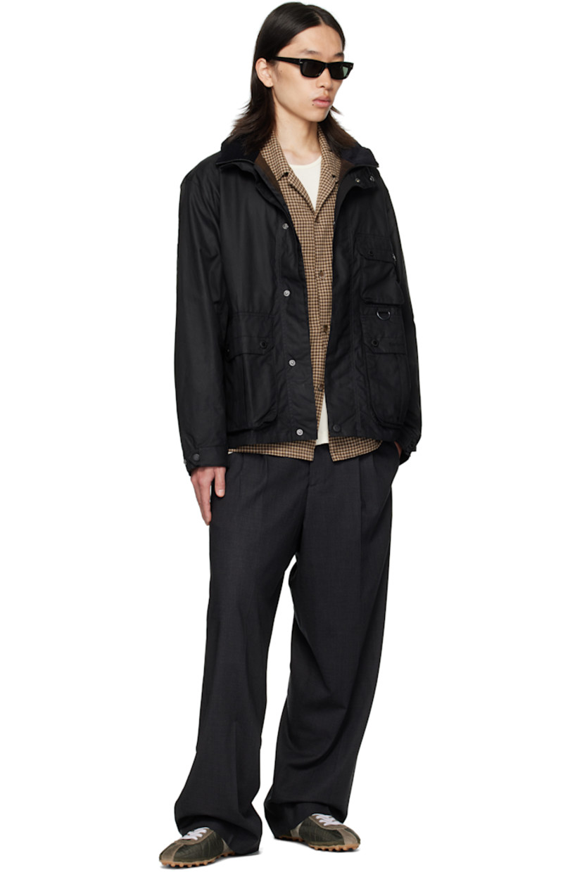 Waxed cotton canvas jacket. 

· Stand collar 
· Concealed two-way zip closure
· Press-stud placket 
· Flap pockets, D-ring, and logo embroidered at front
· Grommets at side seams
· Press-stud cuffs
· Cinch tabs at back hem 
· Patch pocket at interior 
· Partial twill lining

Supplier color: Black