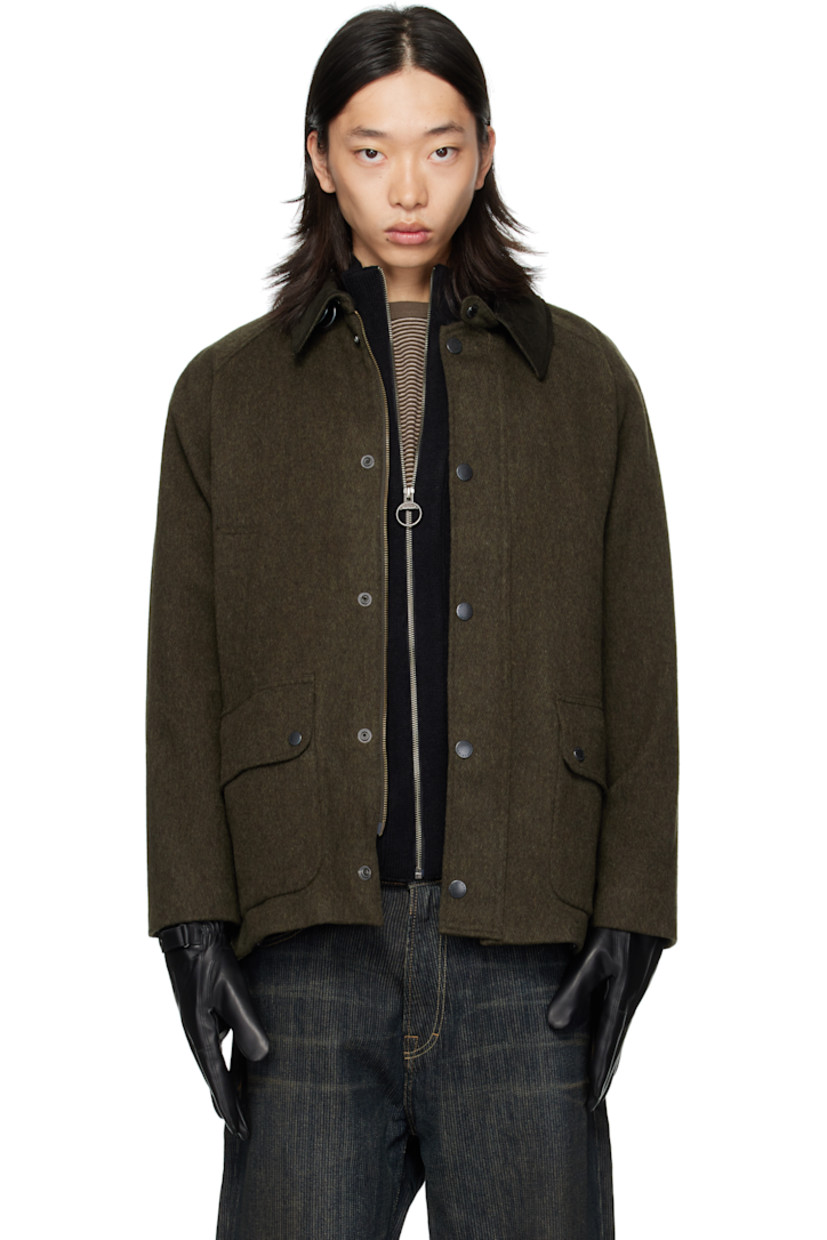 Wool-blend melton jacket.

· Press-stud throat guard at spread collar
· Zip closure with press-stud placket
· Welt pockets and flap pockets at front
· Logo embroidered at front
· Raglan sleeves
· Metal eyelets at underarms
· Press-stud fastening at cuffs
· Press-stud vents at back hem
· Patch pocket at interior
· Full flannel and satin lining

Supplier color: Olive