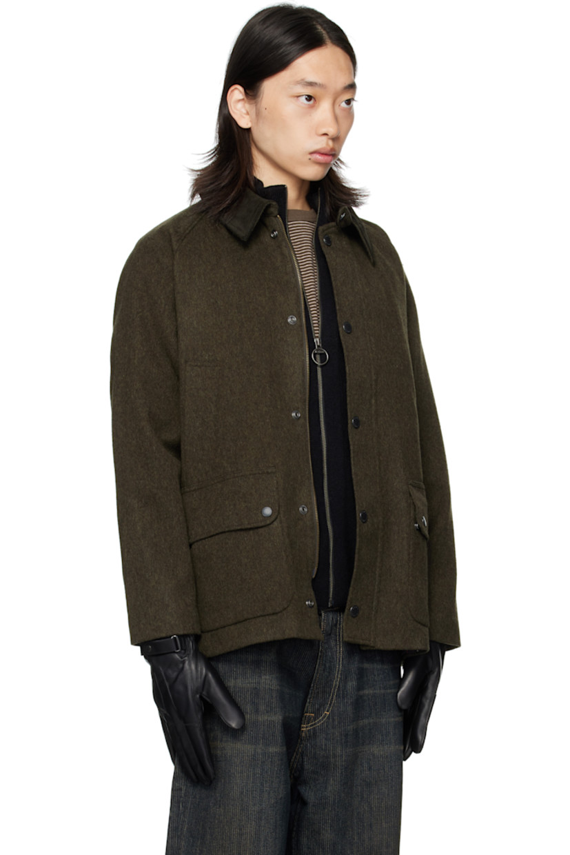 Wool-blend melton jacket.

· Press-stud throat guard at spread collar
· Zip closure with press-stud placket
· Welt pockets and flap pockets at front
· Logo embroidered at front
· Raglan sleeves
· Metal eyelets at underarms
· Press-stud fastening at cuffs
· Press-stud vents at back hem
· Patch pocket at interior
· Full flannel and satin lining

Supplier color: Olive