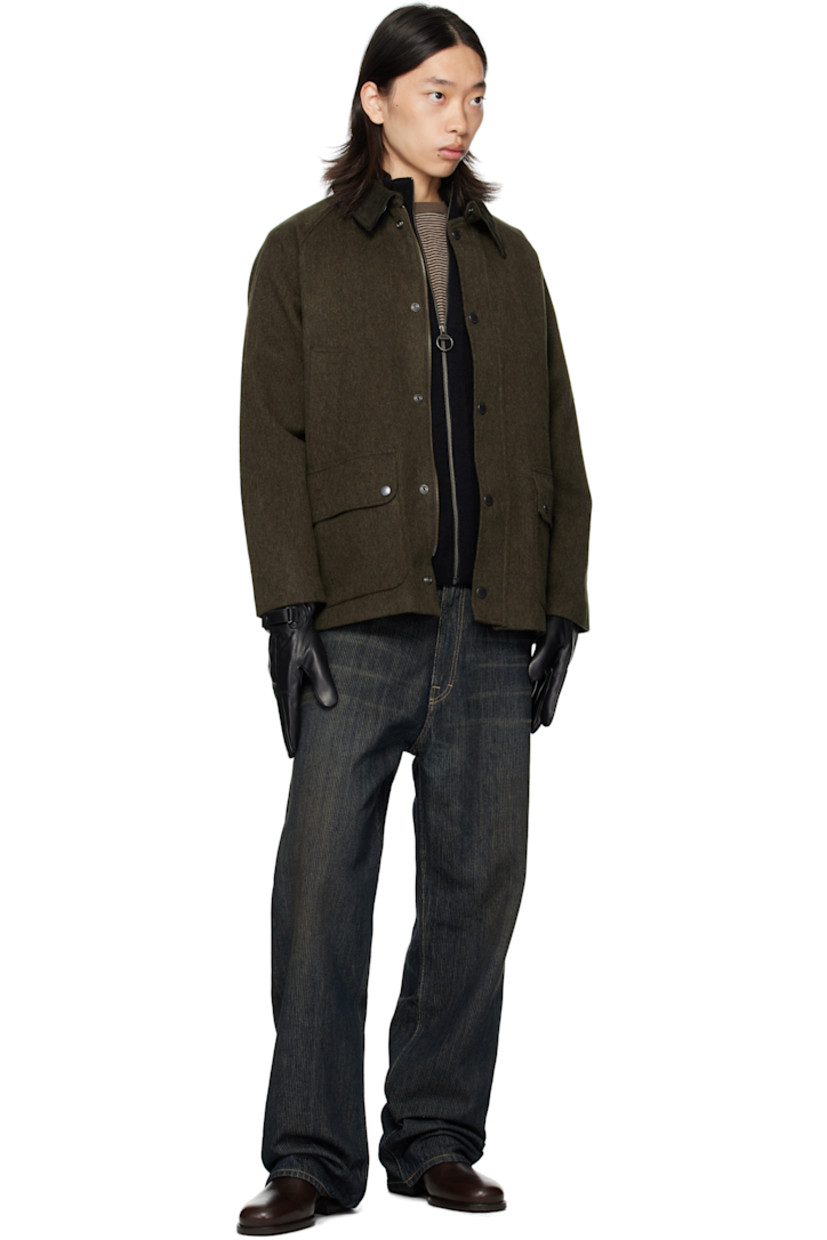 Wool-blend melton jacket.

· Press-stud throat guard at spread collar
· Zip closure with press-stud placket
· Welt pockets and flap pockets at front
· Logo embroidered at front
· Raglan sleeves
· Metal eyelets at underarms
· Press-stud fastening at cuffs
· Press-stud vents at back hem
· Patch pocket at interior
· Full flannel and satin lining

Supplier color: Olive