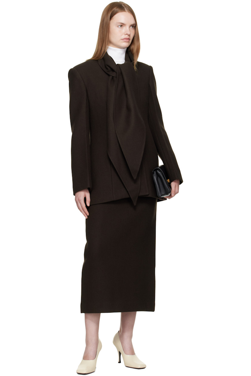 Wool-blend melton midi skirt.

· Darts at waist
· Zip closure at back
· Central vent at back hem
· Full satin lining

Supplier color: Brown