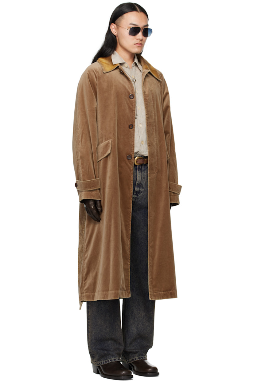 Cotton velvet coat.

· Flocked spread collar 
· Button closure
· Belt loops and welt pockets at waist
· Detachable self-tie belt 
· Raglan sleeves
· Adjustable button tab at cuffs
· Central vent at back hem
· Partial satin lining 

Supplier color: Beige