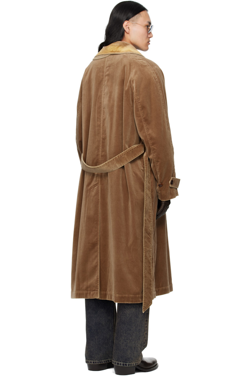 Cotton velvet coat.

· Flocked spread collar 
· Button closure
· Belt loops and welt pockets at waist
· Detachable self-tie belt 
· Raglan sleeves
· Adjustable button tab at cuffs
· Central vent at back hem
· Partial satin lining 

Supplier color: Beige