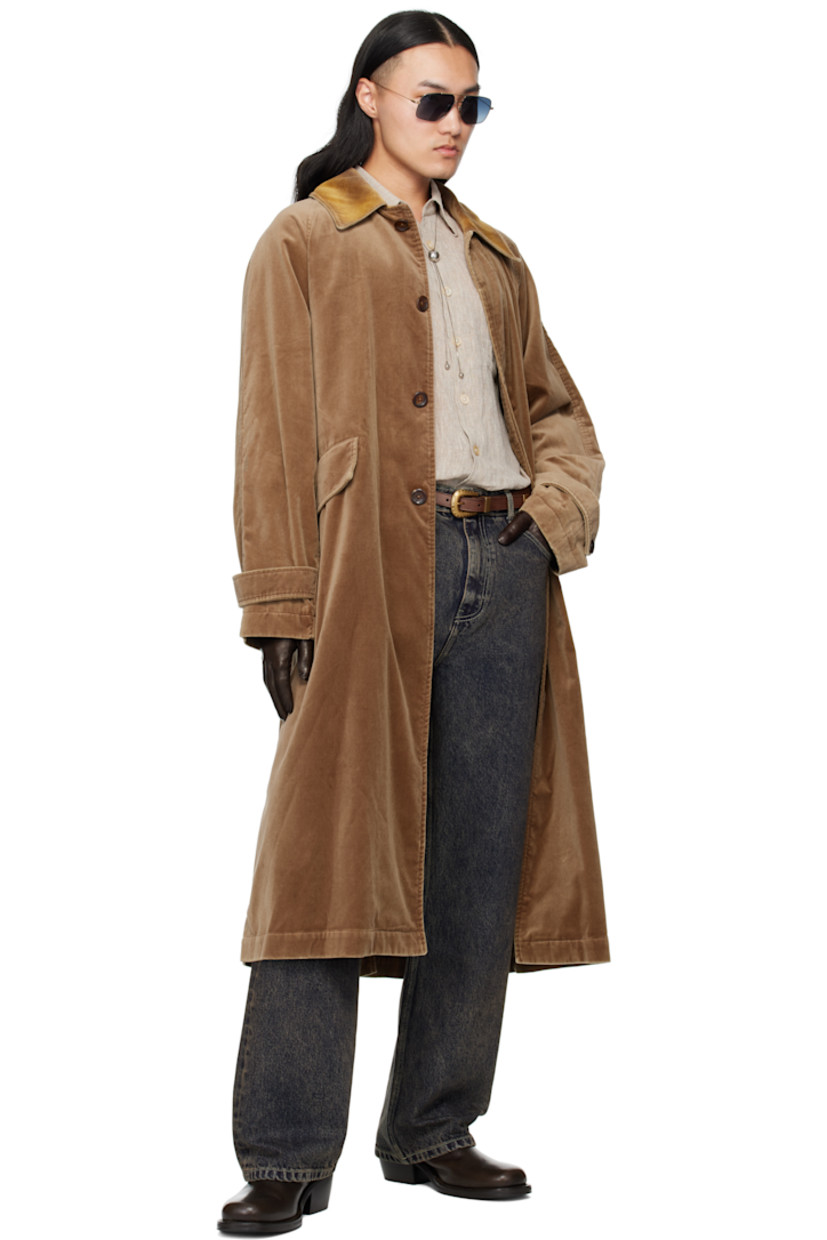 Cotton velvet coat.

· Flocked spread collar 
· Button closure
· Belt loops and welt pockets at waist
· Detachable self-tie belt 
· Raglan sleeves
· Adjustable button tab at cuffs
· Central vent at back hem
· Partial satin lining 

Supplier color: Beige