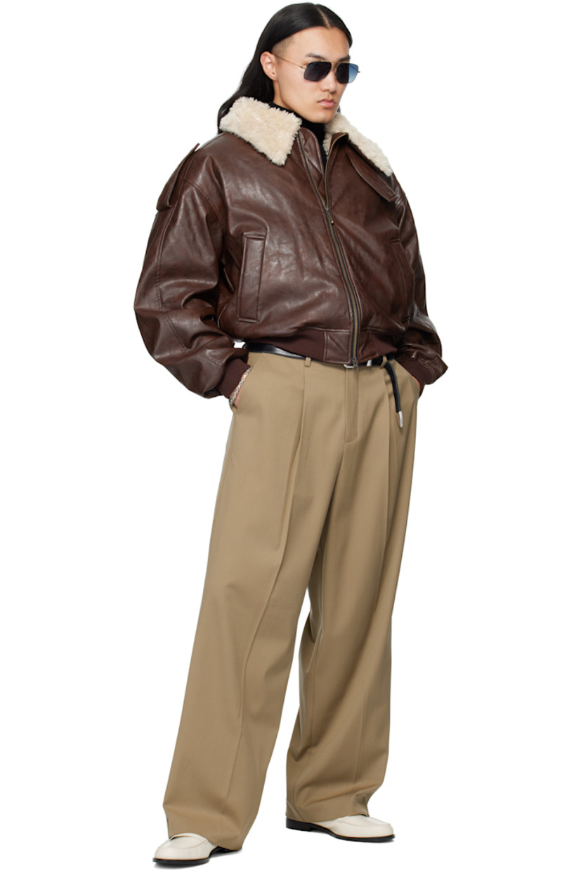 Stretch wool-blend twill trousers.

· Belt loops
· Four-pocket styling
· Zip fly 
· Pleats at front 
· Creased legs
· Contrast stitching in red at outseams

Supplier color: Beige