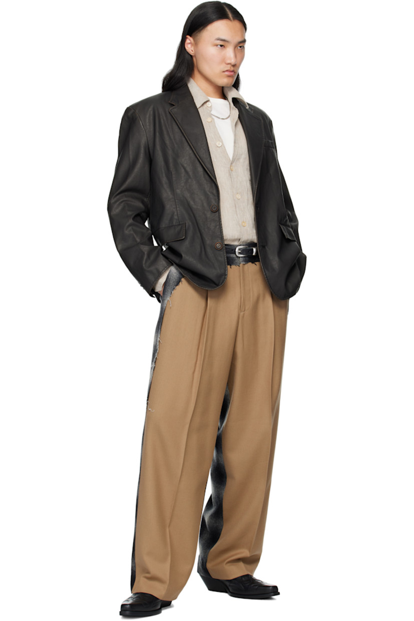 Wool twill and hopsack trousers.

· Paneled construction
· Check flannel panel with raw edges throughout 
· Belt loops
· Four-pocket styling
· Zip fly 
· Pleats at front 
· Creased legs

Supplier color: Beige