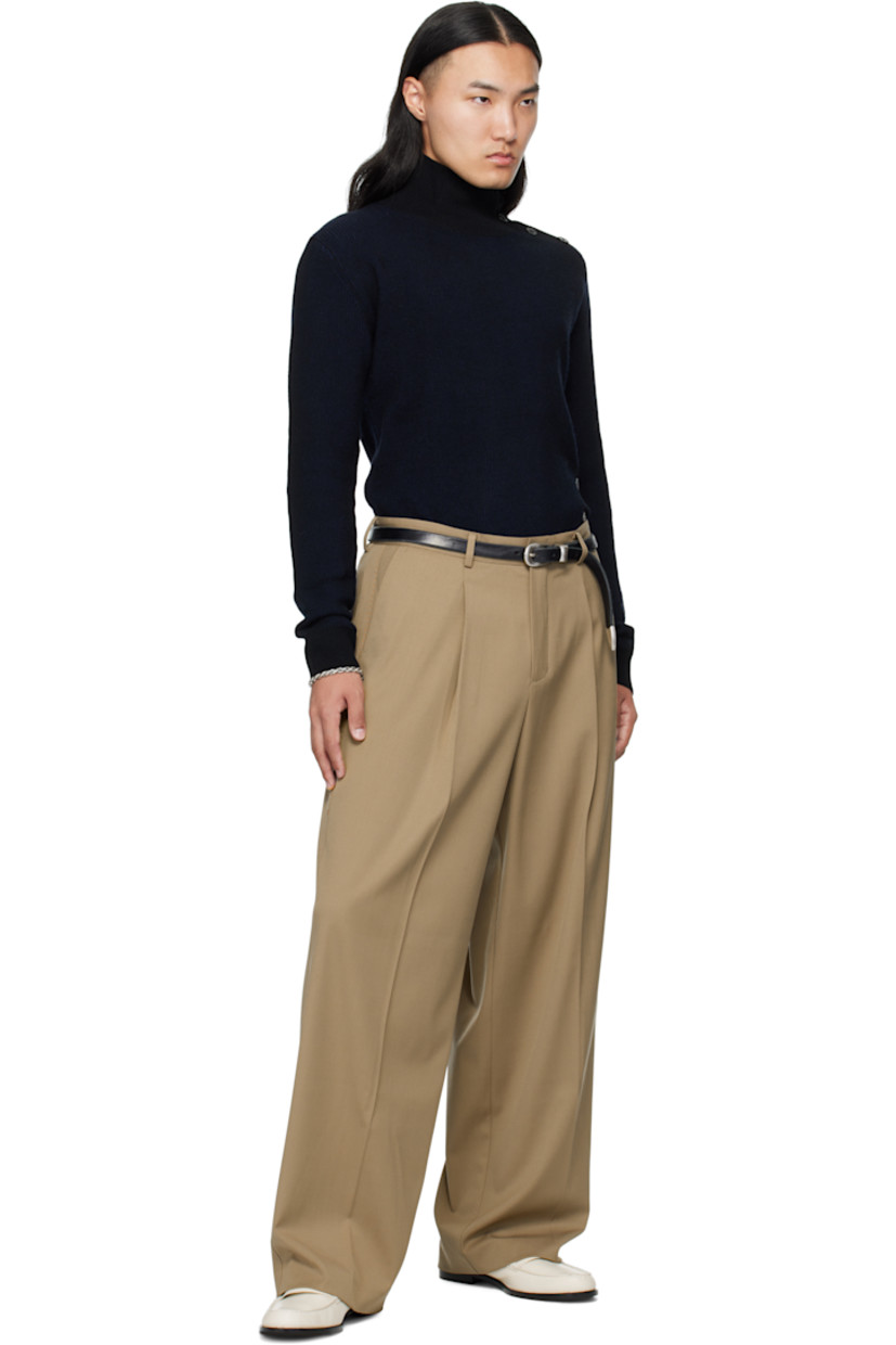 Rib-knit wool-blend turtleneck. Button fastening at collar and offset side seam.

Supplier color: Black