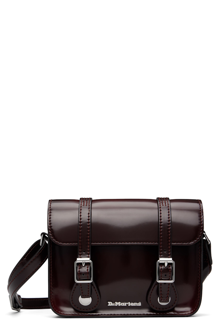 Polished faux-leather shoulder bag.

· Adjustable crossbody strap
· Logo hardware at face
· Pin-buckle tabs at magnetic press-stud flap
· Twill lining
· Logo-engraved silver-tone hardware
· H5" x W7" x D2"

Supplier color: Cherry red