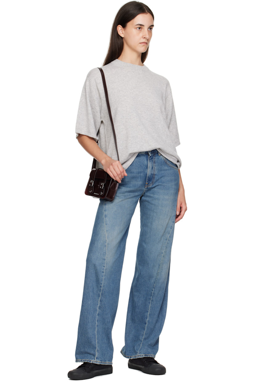 Polished faux-leather shoulder bag.

· Adjustable crossbody strap
· Logo hardware at face
· Pin-buckle tabs at magnetic press-stud flap
· Twill lining
· Logo-engraved silver-tone hardware
· H5" x W7" x D2"

Supplier color: Cherry red