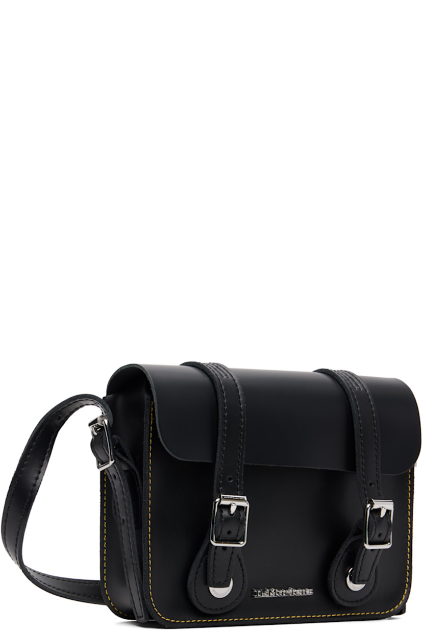 Buffed leather shoulder bag.

· Adjustable crossbody strap
· Logo hardware at face
· Mock buckles at magnetic press-stud flap
· Suede lining
· Contrast stitching in yellow
· H5.5" x W7" x D2"

Supplier color: Black smooth leather