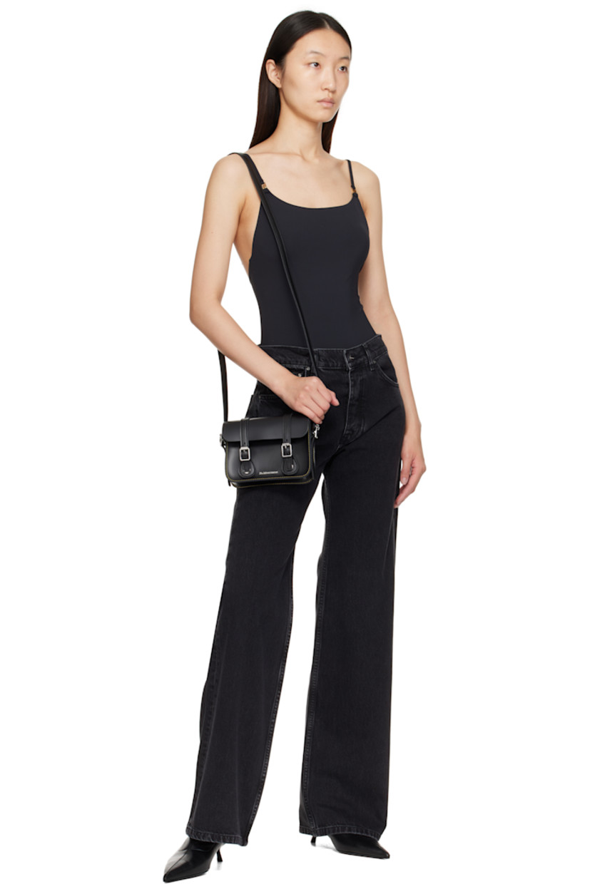 Buffed leather shoulder bag.

· Adjustable crossbody strap
· Logo hardware at face
· Mock buckles at magnetic press-stud flap
· Suede lining
· Contrast stitching in yellow
· H5.5" x W7" x D2"

Supplier color: Black smooth leather