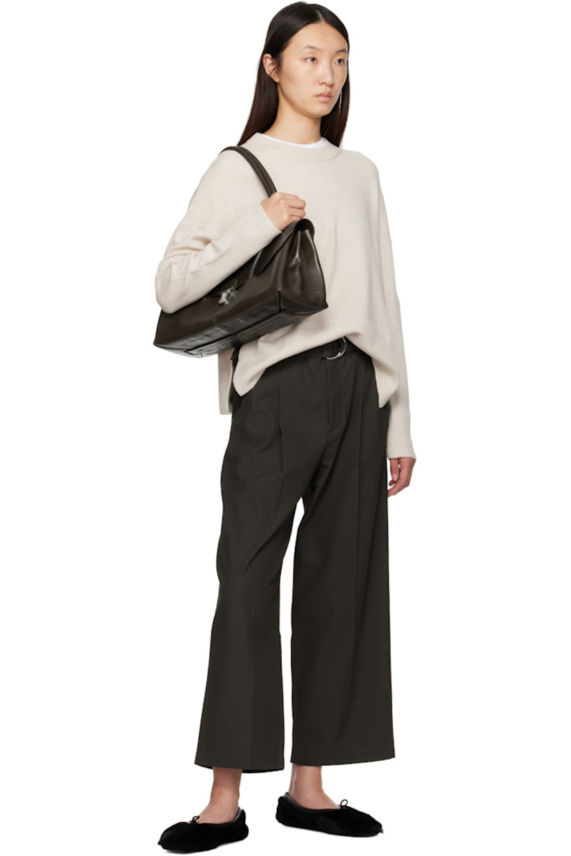 Organic cotton twill trousers.

· Wide-leg
· Mid-rise
· Belt loops
· Four-pocket styling
· Zip fly
· Pleats at front
· Creased legs

Supplier color: Dark Loden Green
