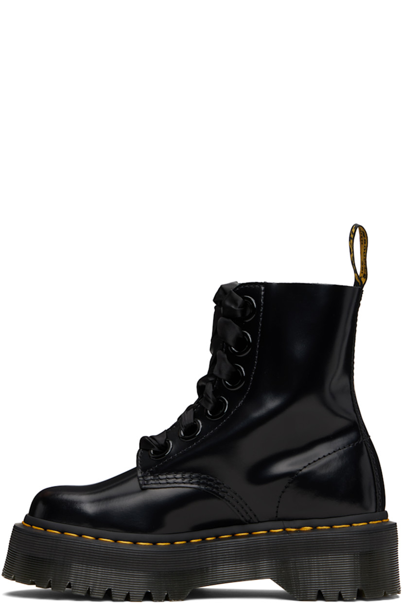 Ankle-high polished leather boots.

· Lace-up closure
· Pull-loop at heel collar
· Suede lining
· Yellow topstitching at heat-sealed Goodyear welt
· Treaded Air Cushion rubber platform sole
· Platform: H1.75"

Supplier color: Black buttero