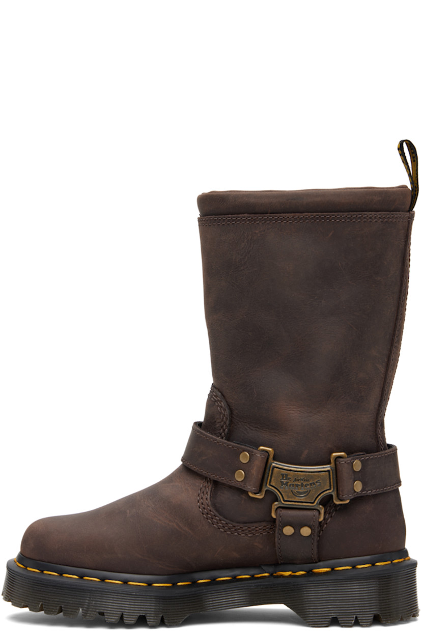 Mid-calf waxed leather boots.

· Padded collar
· Gusset and pin-buckle strap at outer side
· Logo plaques at harness-style ankle strap
· Logo-woven pull-loop at heel collar
· Yellow topstitching at heat-sealed Goodyear welt
· Treaded Air Cushion rubber sole

Supplier color: Dark brown burnished waxy pull up wp