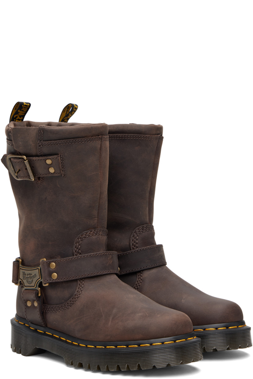 Mid-calf waxed leather boots.

· Padded collar
· Gusset and pin-buckle strap at outer side
· Logo plaques at harness-style ankle strap
· Logo-woven pull-loop at heel collar
· Yellow topstitching at heat-sealed Goodyear welt
· Treaded Air Cushion rubber sole

Supplier color: Dark brown burnished waxy pull up wp
