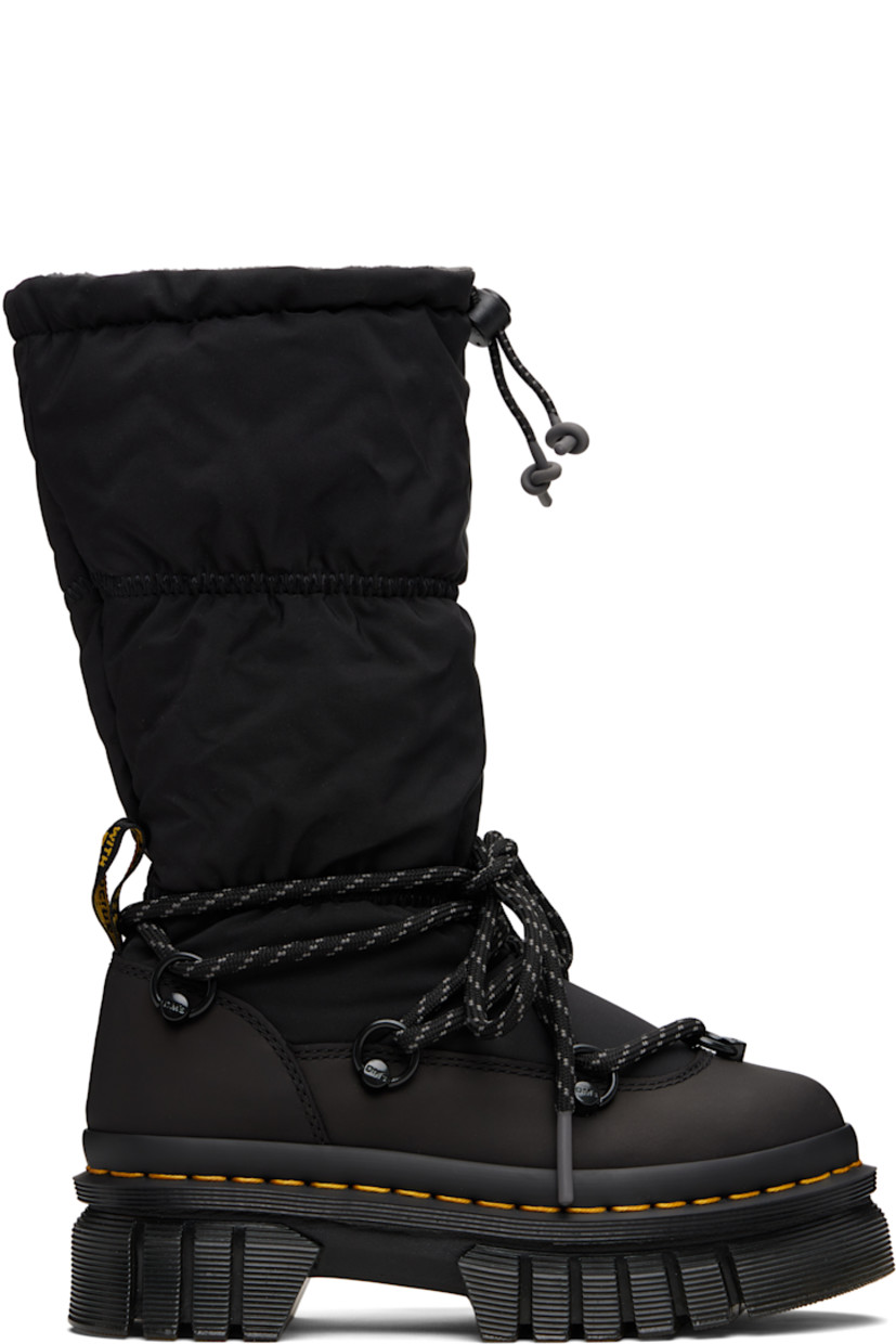 Mid-calf padded taffeta and buffed leather boots.

· Lace-up closure
· Cord-lock drawstring at elasticized collar
· Pull-loop at heel counter
· Fleece lining
· Yellow topstitching at heat-sealed Goodyear welt
· Treaded Air Cushion rubber platform sole
· Platform: H1.75"

Supplier color: Black