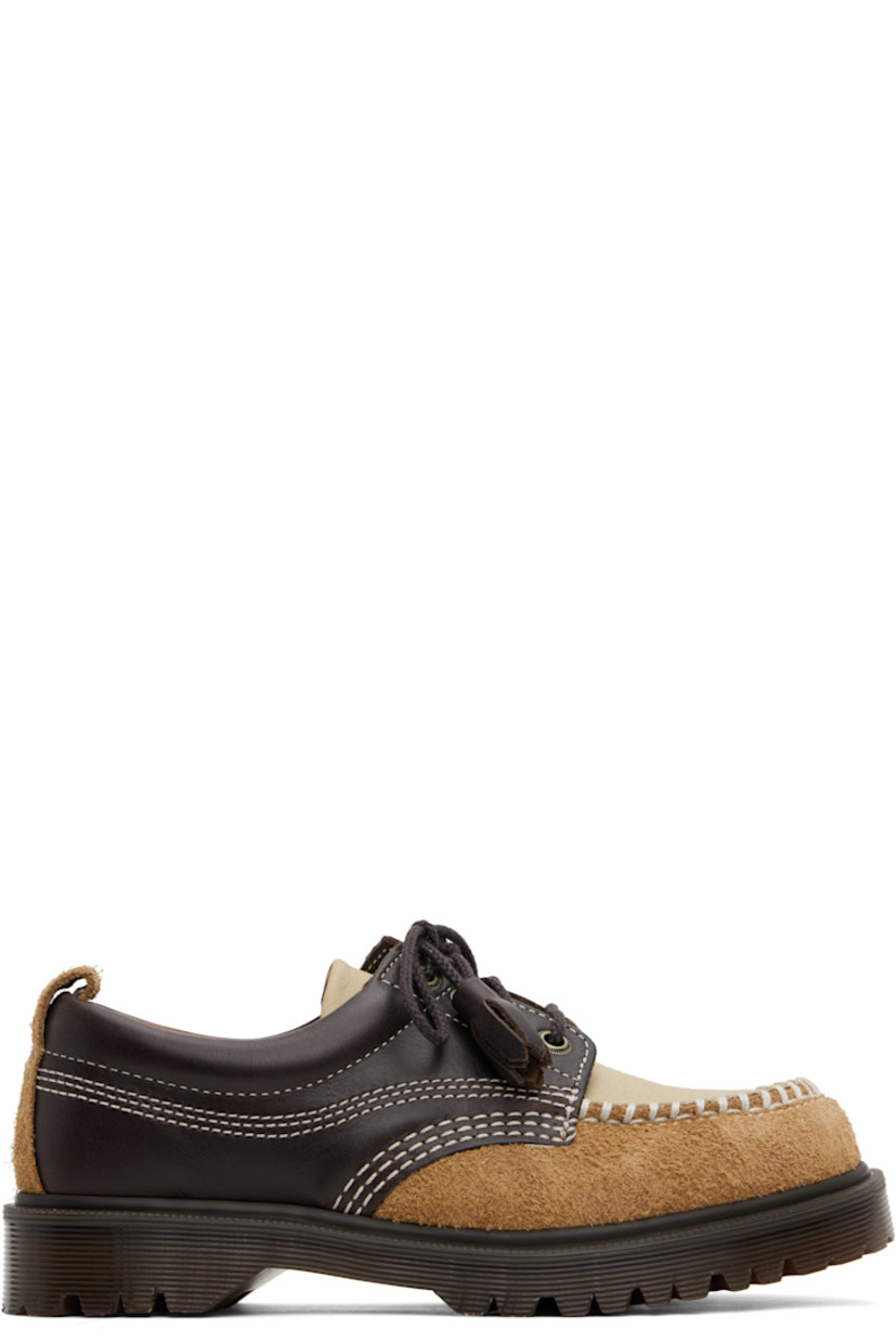Buffed leather, nubuck, and suede derbys in brown and beige.

· Blanket stitching at moc toe
· Tassels at lace-up closure
· Padded collar
· Pull-loop at heel collar
· Buffed leather and suede lining
· Serrated detailing at heat-sealed Goodyear welt
· Treaded Air Cushion rubber sole
· Contrast stitching in white

Supplier color: Dark brown/Light tan