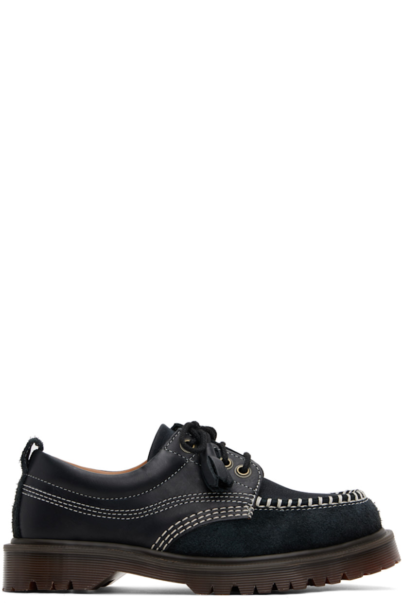 Buffed leather, nubuck, and suede derbys in black.

· Blanket stitching at moc toe
· Tassels at lace-up closure
· Padded collar
· Pull-loop at heel collar
· Buffed leather and suede lining
· Serrated detailing at heat-sealed Goodyear welt
· Treaded Air Cushion rubber sole
· Contrast stitching in white

Supplier color: Black kinsley tumble