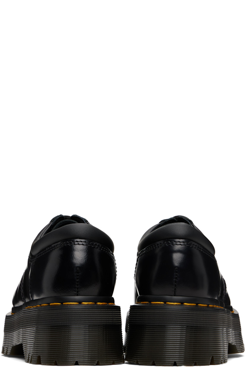 Polished leather derbys.

· Lace-up closure
· Padded collar
· Buffed leather lining
· Yellow topstitching at heat-sealed Goodyear welt
· Treaded Air Cushion rubber platform sole
· Platform: H1.75"

Supplier color: Black polished smooth