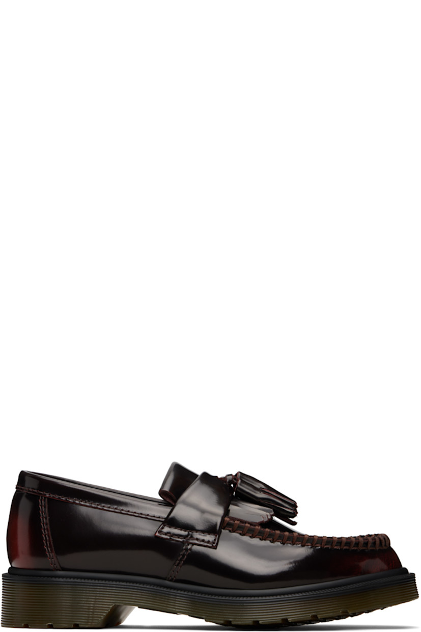 Polished leather loafers.

· Blanket stitching at moc toe
· Strap with tassel at vamp
· Suede lining
· Heat-sealed Goodyear welt
· Treaded Air Cushion rubber sole

Supplier color: Cherry red arcadia