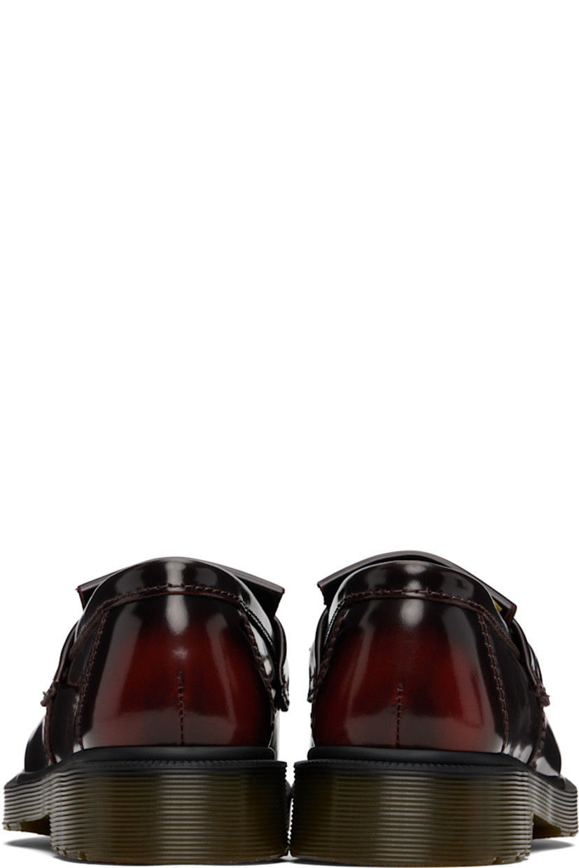 Polished leather loafers.

· Blanket stitching at moc toe
· Strap with tassel at vamp
· Suede lining
· Heat-sealed Goodyear welt
· Treaded Air Cushion rubber sole

Supplier color: Cherry red arcadia