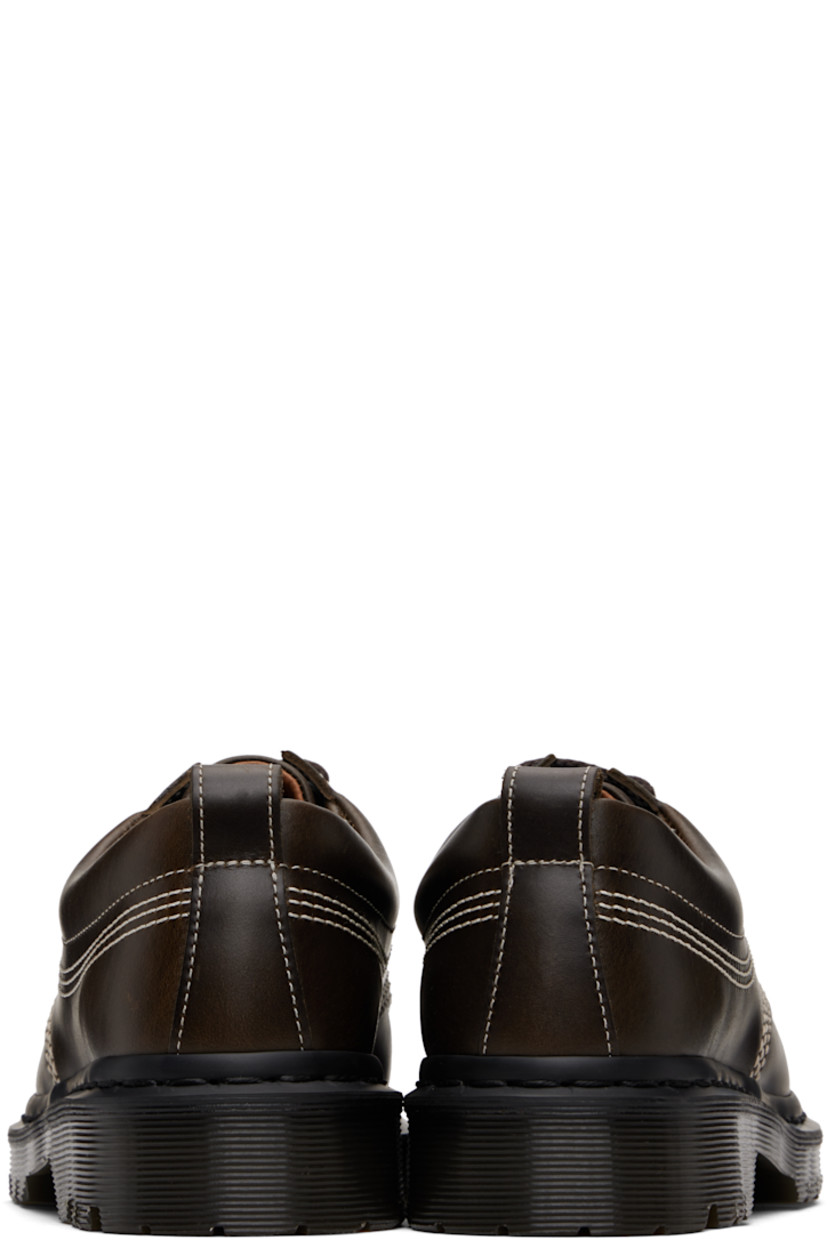 Polished leather derbys.

· Blanket stitching at moc toe
· Lace-up closure
· Padded collar
· Pull-loop at heel collar
· Buffed leather lining
· Stitching at heat-sealed Goodyear welt
· Treaded Air Cushion rubber sole
· Contrast stitching in off-white

Supplier color: Olive