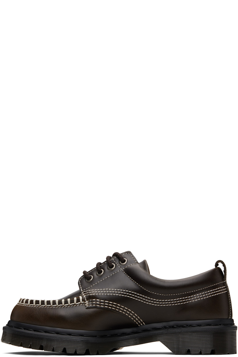 Polished leather derbys.

· Blanket stitching at moc toe
· Lace-up closure
· Padded collar
· Pull-loop at heel collar
· Buffed leather lining
· Stitching at heat-sealed Goodyear welt
· Treaded Air Cushion rubber sole
· Contrast stitching in off-white

Supplier color: Olive