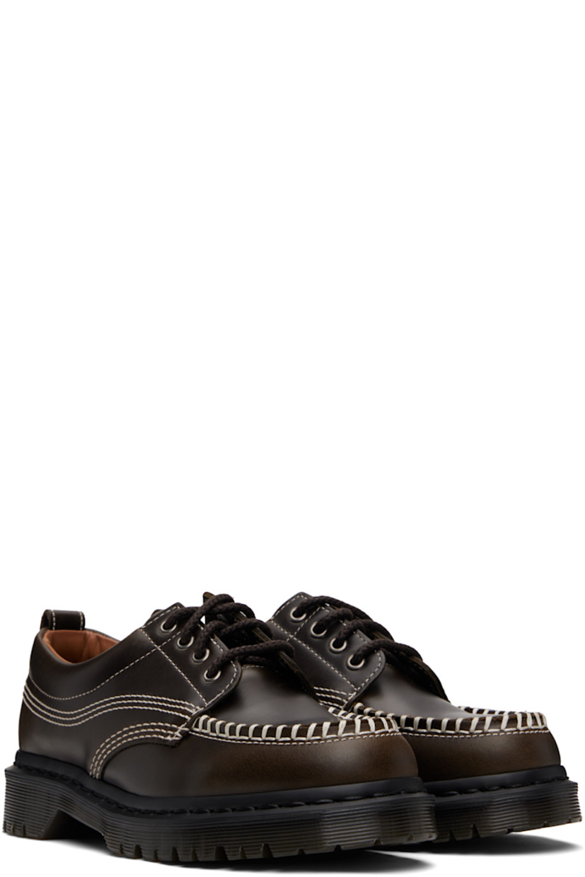 Polished leather derbys.

· Blanket stitching at moc toe
· Lace-up closure
· Padded collar
· Pull-loop at heel collar
· Buffed leather lining
· Stitching at heat-sealed Goodyear welt
· Treaded Air Cushion rubber sole
· Contrast stitching in off-white

Supplier color: Olive