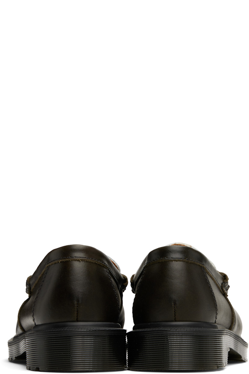Handcrafted buffed calfskin loafers in brown and white.

· Calfskin by Charles F Stead & Co.
· Blanket stitching at moc toe
· Strap with logo hardware at vamp
· Suede lining
· Heat-sealed Goodyear welt
· Treaded Air Cushion rubber sole

Supplier color: Olive/White