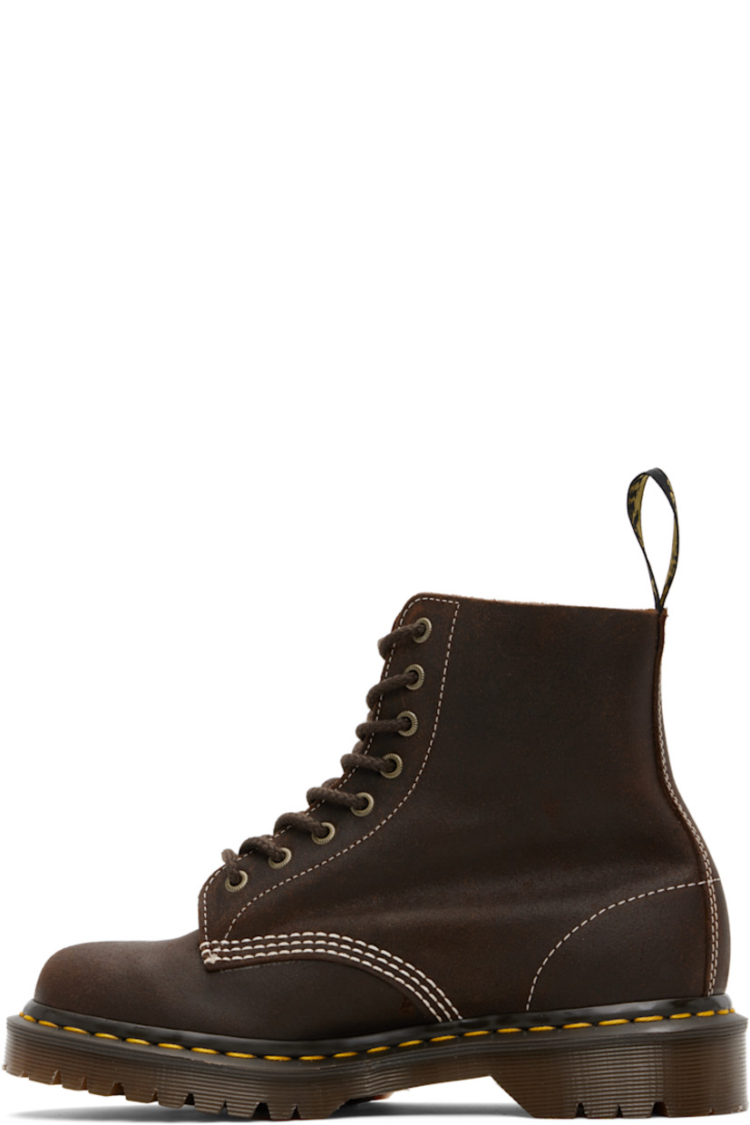 Handcrafted ankle-high waxed buffed leather boots.

· Removable logo tag at lace-up closure
· Jacquard logo-woven pull-loop at heel collar
· Suede lining
· Yellow stitching at heat-sealed Goodyear welt
· Treaded AirWair™ air-cushioned rubber sole
· Contrast stitching in white

Supplier color: Brown/Wax commander