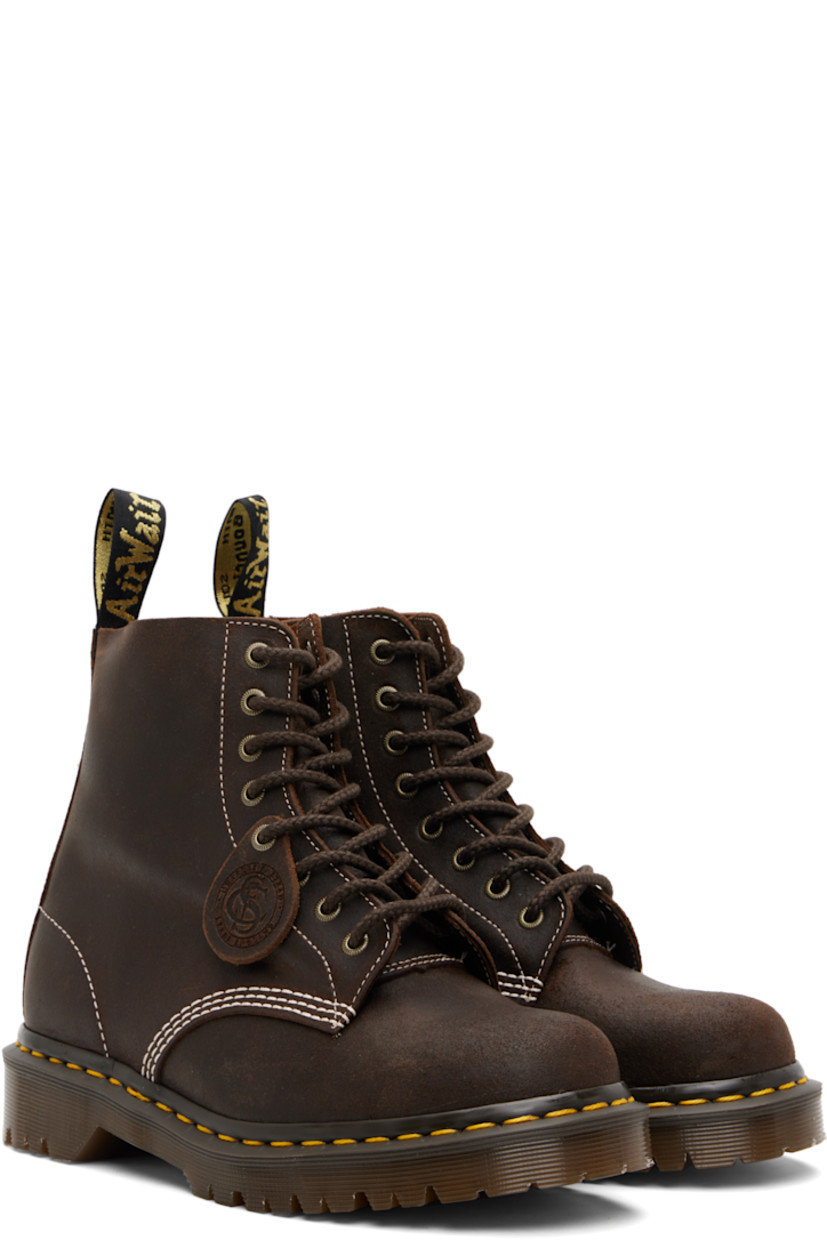 Handcrafted ankle-high waxed buffed leather boots.

· Removable logo tag at lace-up closure
· Jacquard logo-woven pull-loop at heel collar
· Suede lining
· Yellow stitching at heat-sealed Goodyear welt
· Treaded AirWair™ air-cushioned rubber sole
· Contrast stitching in white

Supplier color: Brown/Wax commander