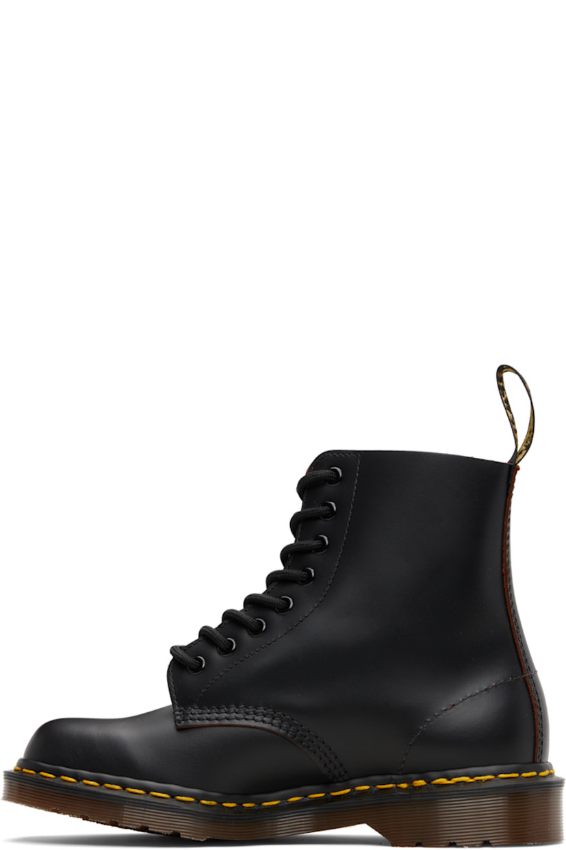 Handcrafted ankle-high buffed leather boots.

· Lace-up closure
· Jacquard logo-woven pull-loop at heel collar
· Textile lining
· Yellow stitching at heat-sealed Goodyear welt
· Treaded Air Cushion rubber sole

Supplier color: Black/Quilon