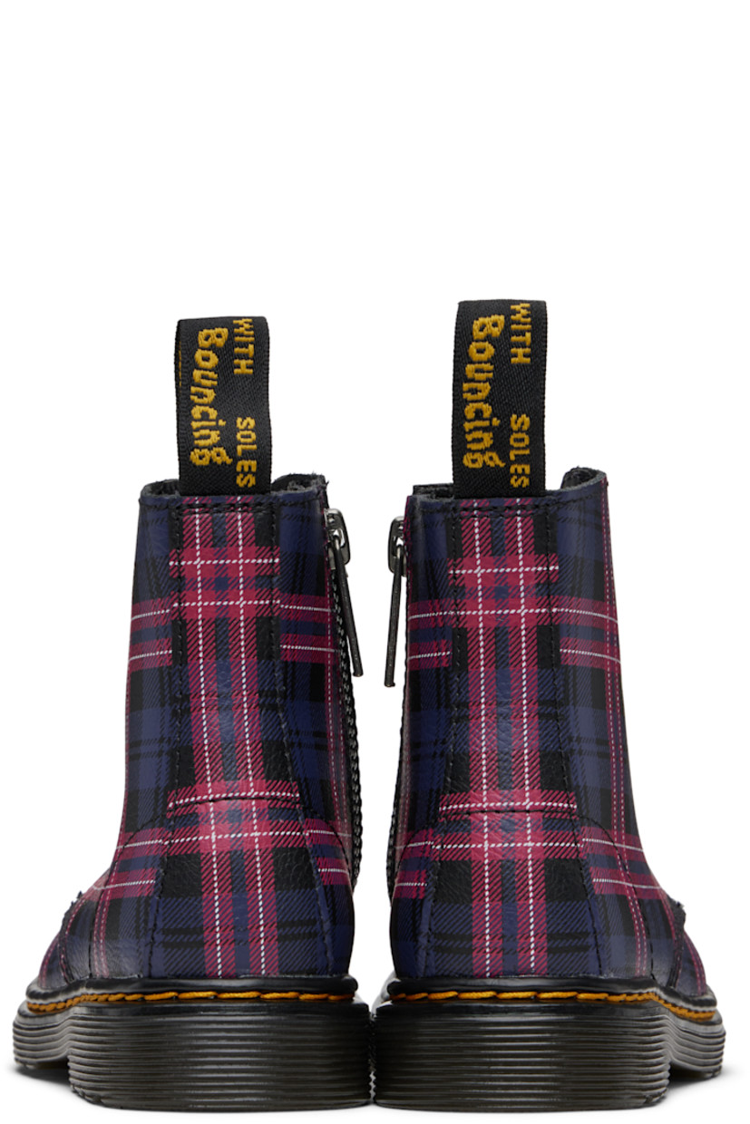 Ankle-high grained leather boots.

· Check pattern throughout
· Lace-up closure
· Zip closure at inner side
· Logo-woven pull-loop at heel collar
· Yellow topstitching at heat-sealed Goodyear welt
· Treaded Air Cushion rubber sole
· Logo-engraved antiqued silver-tone hardware

Supplier color: Black/Multi

Dr. Martens US Size: child's foot length 
10: 6.86” / 17.4 cm 
11: 7.2” / 18.3 cm 
12: 7.53” / 19.1 cm 
13: 7.87” / 20 cm 
1Y: 8.2” / 20.8 cm 
2Y: 8.54” / 21.7 cm 
3Y: 8.86” / 22.5 cm 
4Y: 9.21” / 23.4 cm 
5Y: 9.54” / 24.2 cm 
6Y: 9.88” / 25.1 cm
