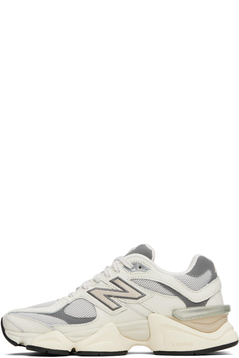 Low-top mesh and pigskin suede sneakers in white and gray.

· Logo embroidered at vamp and heel tab
· Lace-up closure
· Inset logo patch at padded tongue
· Padded collar
· Logo appliqué at sides
· Jersey lining
· CR stability unit at heel
· ABZORB SBS foam rubber midsole
· Treaded rubber sole

Supplier color: Sea salt/White/Grey