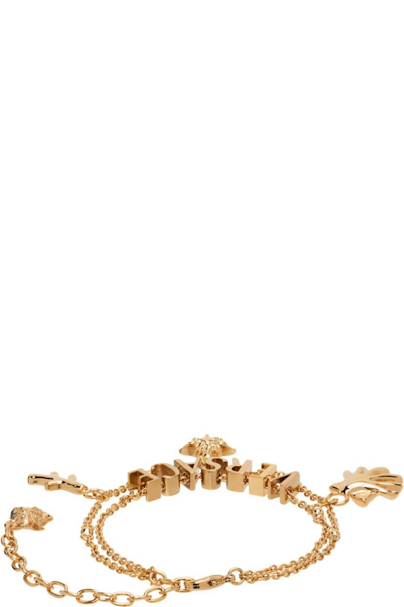 Tiered cable chain bracelet in gold tone. 

· Logo and graphic charms throughout 
· Medusa charm at adjustable lobster-clasp fastening 
· L9"

Part of the La Vacanza collection.

Supplier color: Light gold
