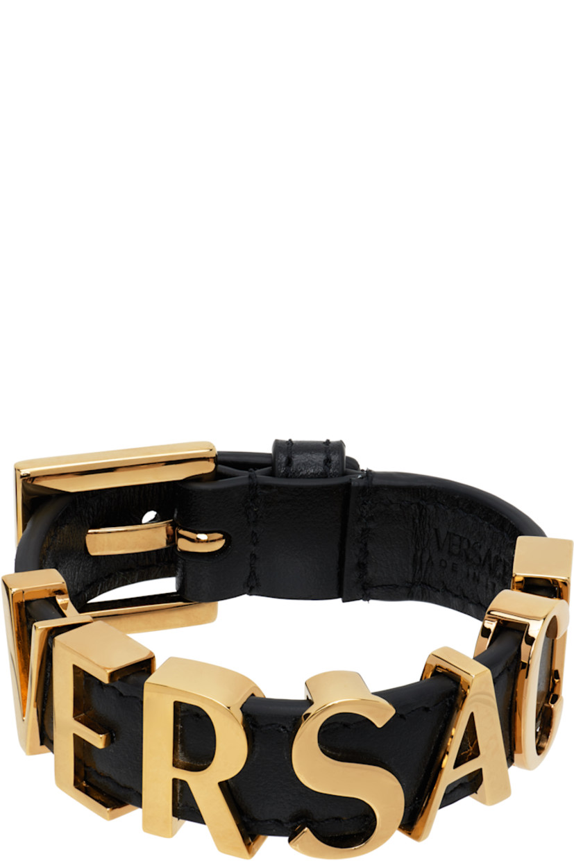 Buffed leather bracelet in black. 

· Logo hardware at length
· Pin-buckle fastening 
· Gold-tone hardware 
· L8.75"

Supplier color: Black/Gold
