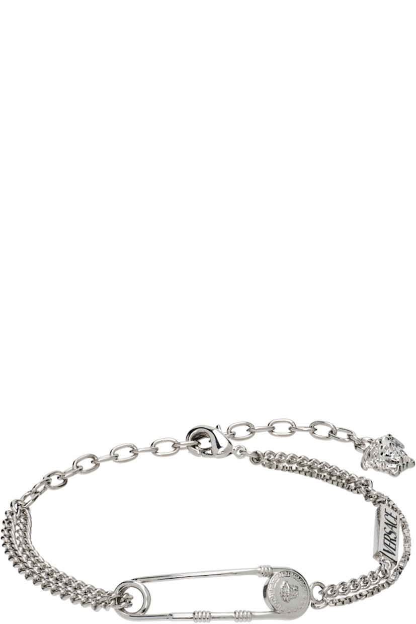 Tiered cable chain, curb chain, and box chain bracelet in silver tone.

· Logo plaque at length
· Medusa-engraved safety-pin hardware
· Logo charm at adjustable lobster-clasp fastening 
· L8.5"

Supplier color: Silver