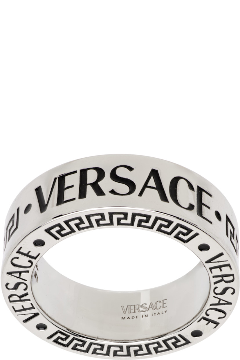 Band ring in silver tone. Enameled logo and Greek key throughout.

Supplier color: Palladium/Black