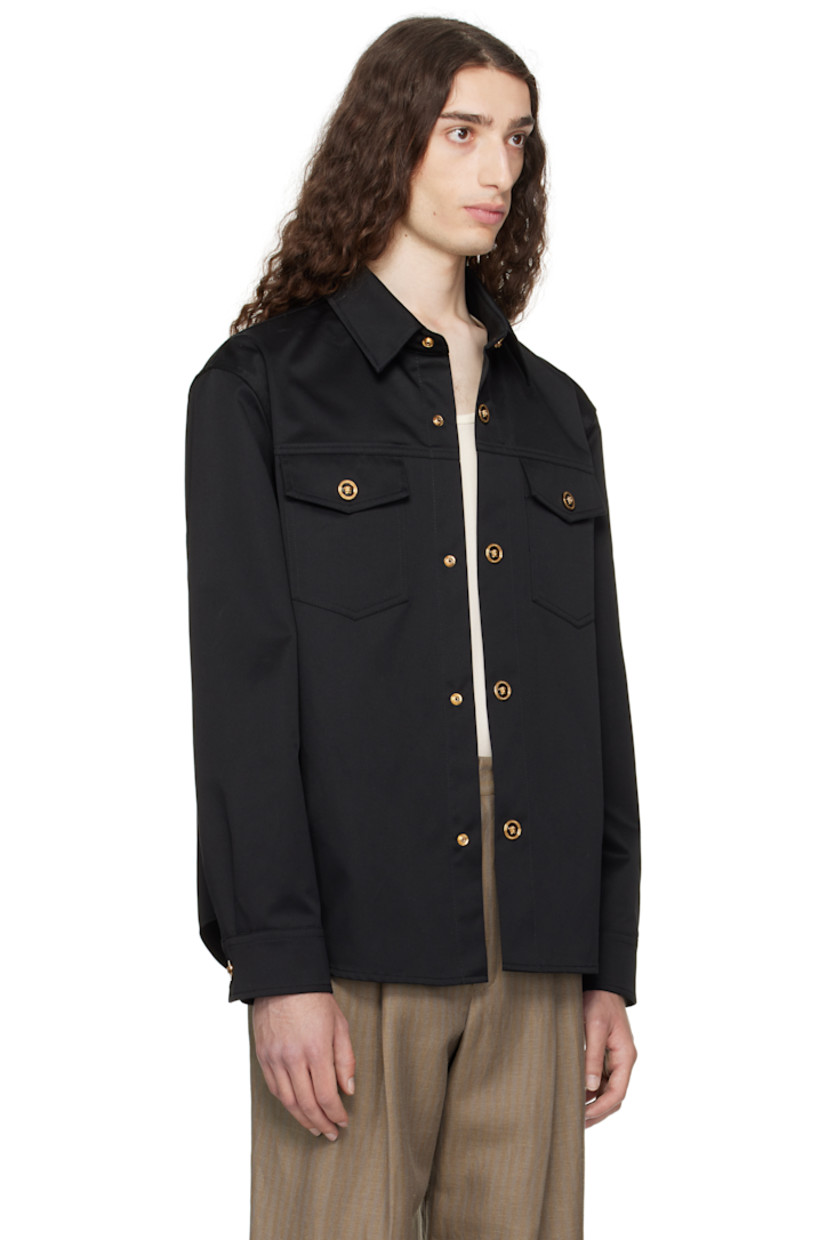 Cotton gabardine overshirt. 

· Spread collar
· Press-stud closure
· Flap pockets at chest
· Shirttail hem 
· Buttoned barrel cuffs
· Logo-engraved gold-tone hardware

Supplier color: Black