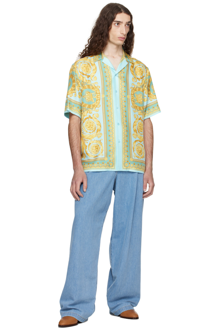 Silk twill shirt. Barocco pattern printed throughout.
 
· Open spread collar
· Button closure
· Vented side seams 

Part of the La Vacanza collection.

Supplier color: Green/Gold