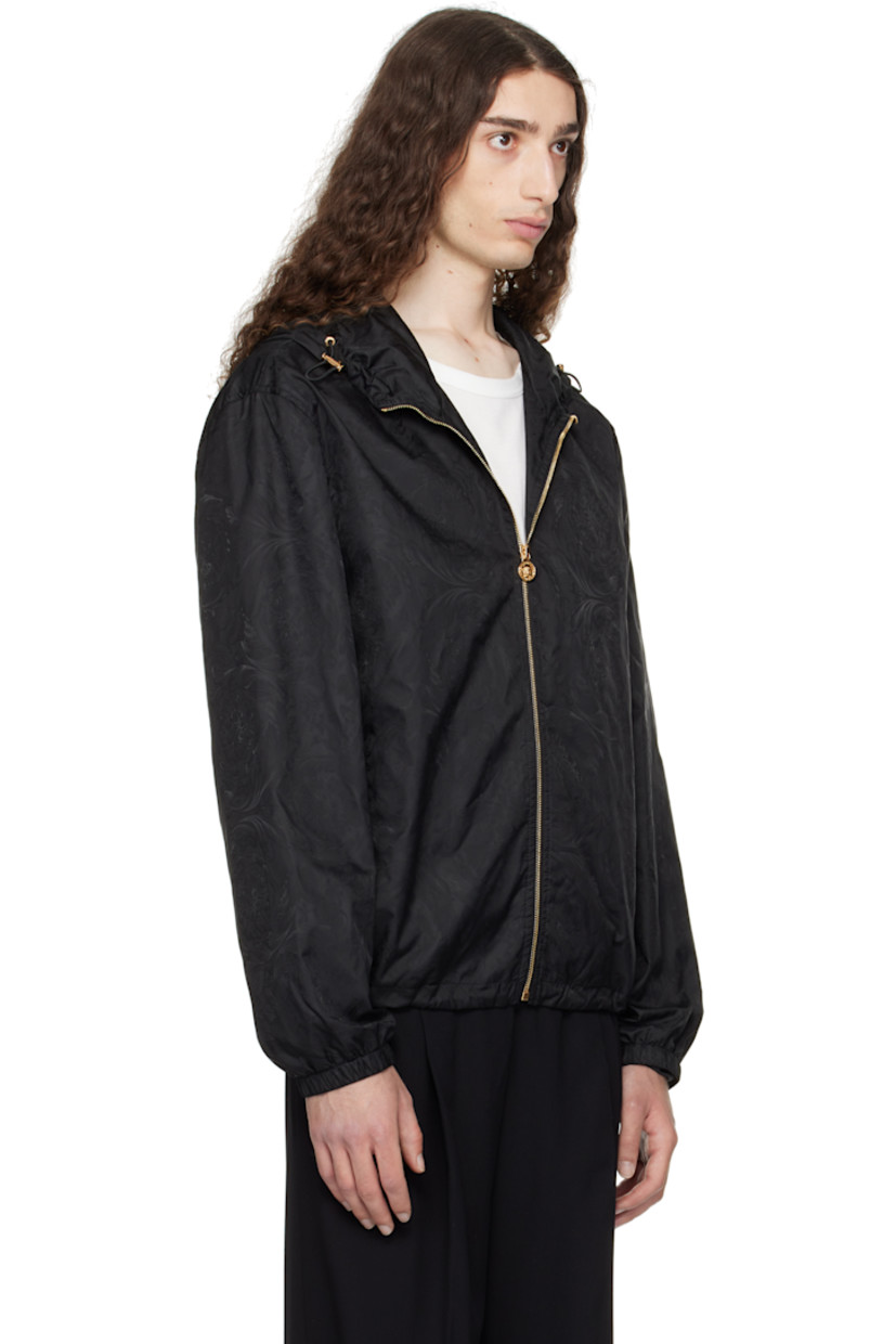Nylon satin jacket. 

· Jacquard logo graphic pattern throughout 
· Bungee-style drawstring at hood and hem 
· Zip closure 
· Welt pockets
· Elasticized cuffs
· Zip pocket at interior 
· Full satin lining 

Supplier color: Black